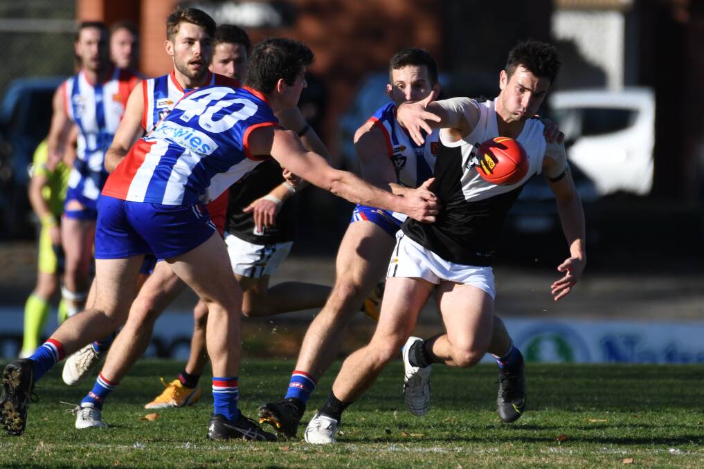North Ballarat captain Simon McCartin tries to glide through East Point's defence earlier this season. Picture: Kate Healty
