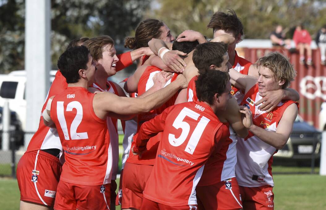 The Swans celebrate a goal against Darley. Picture: Lachlan Bence