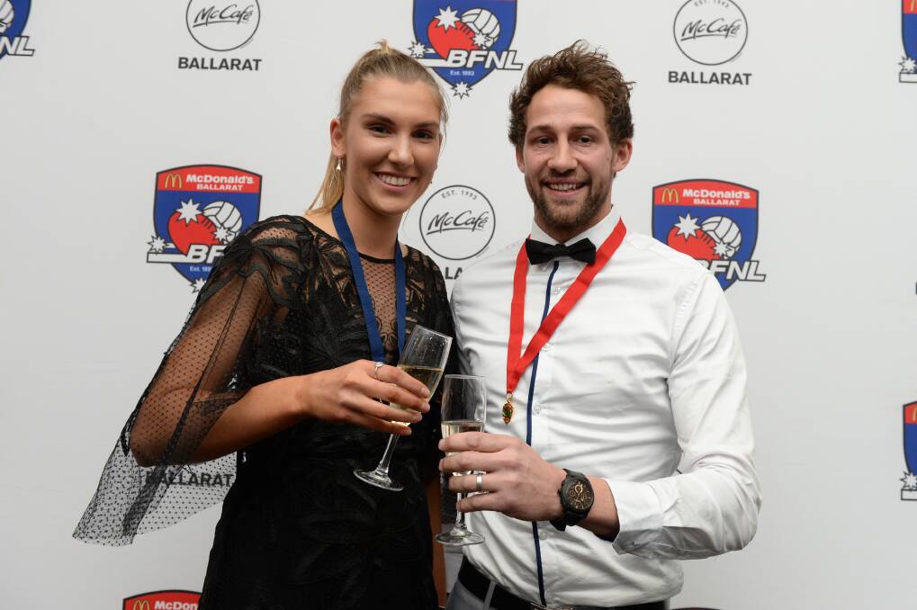 WINNERS ARE GRINNERS: Madison Selmon and Alik Magin celebrate after their best and fairest victories in 2019. Picture: Kate Healy