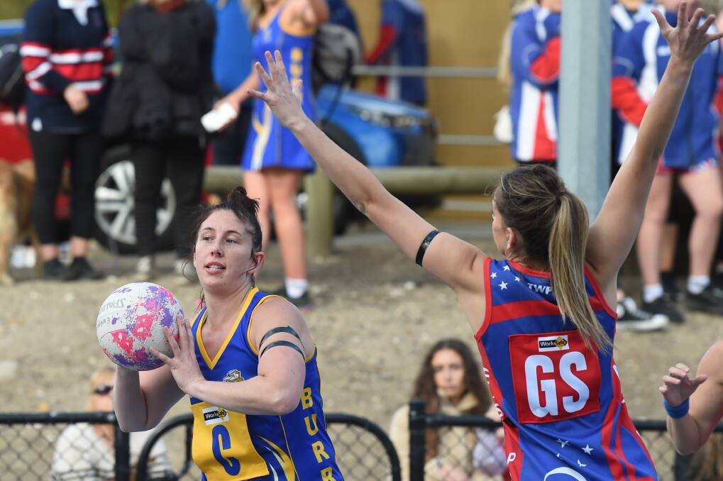 Sebastopol co-coach Narelle Perkins tries to move the ball up the court under pressure from Stacey Edge. Picture: Kate Healy