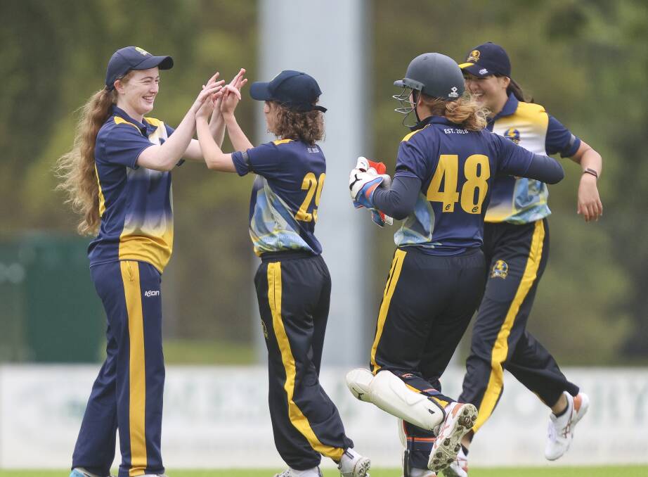 SAFE HANDS: Megan O'Beirne celebrates a catch with teammates in the semi-final win. Picture: Luke Hemer 
