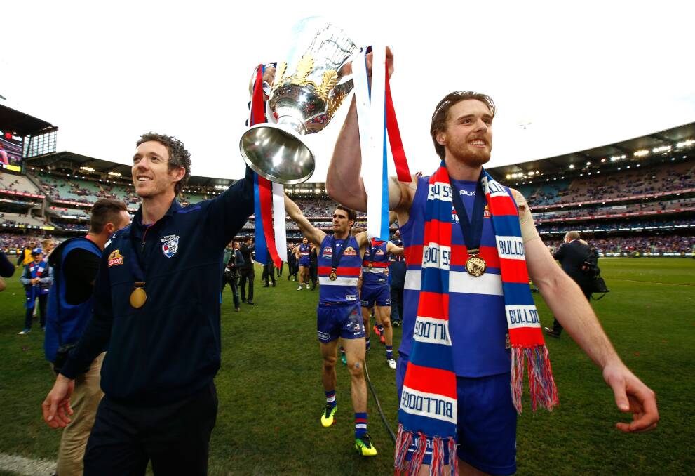 Jordan Roughead celebrates the Western Bulldogs' 2016 premiership with Bob Murphy. Picture: Getty Images.