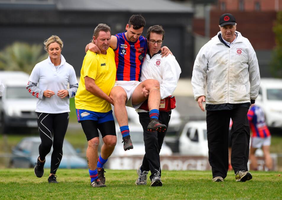 DOWN: Hepburn's Rhys Jenkins is carried from the field during the 2019 CHFL season. Picture: Adam Trafford