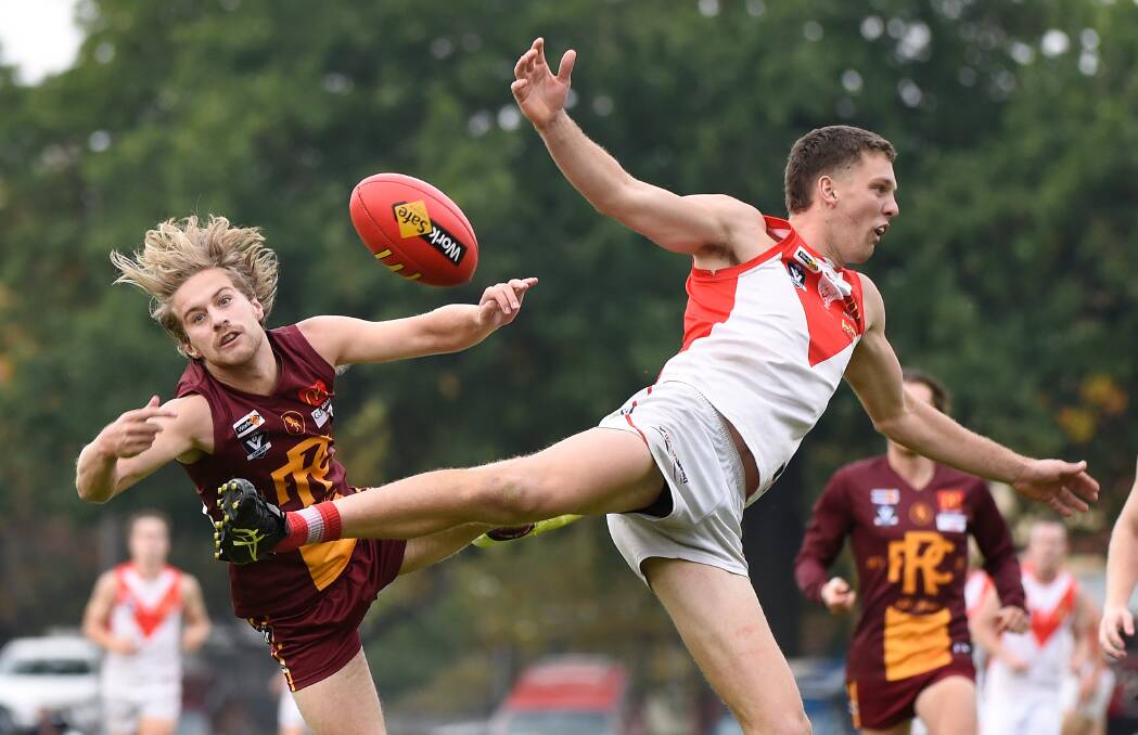 Players fly for the ball during Redan's win against Ballarat. Picture: Adam Trafford