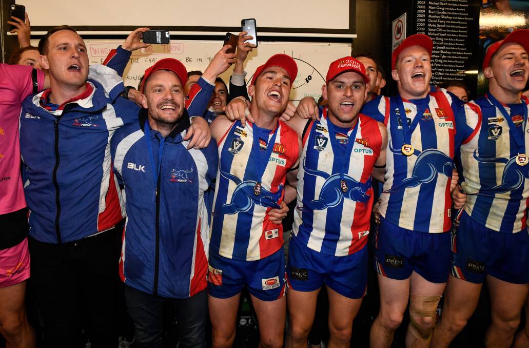 Bridges, second from left, celebrates East Point's 2019 grand final win. Picture: Adam Trafford