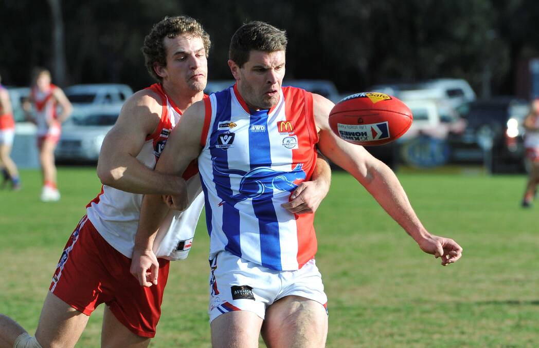 Ballarat's Luke Wynd and East Point's Brad Whittaker chase the loose ball. Picture: Lachlan Bence