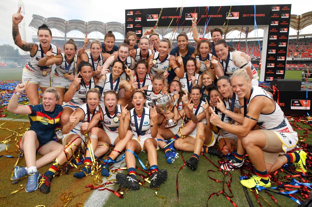 Sally Riley, back row second from left, celebrates Adelaide's 2017 AFLW premiership. Picture: Michael Willson/AFL Photos