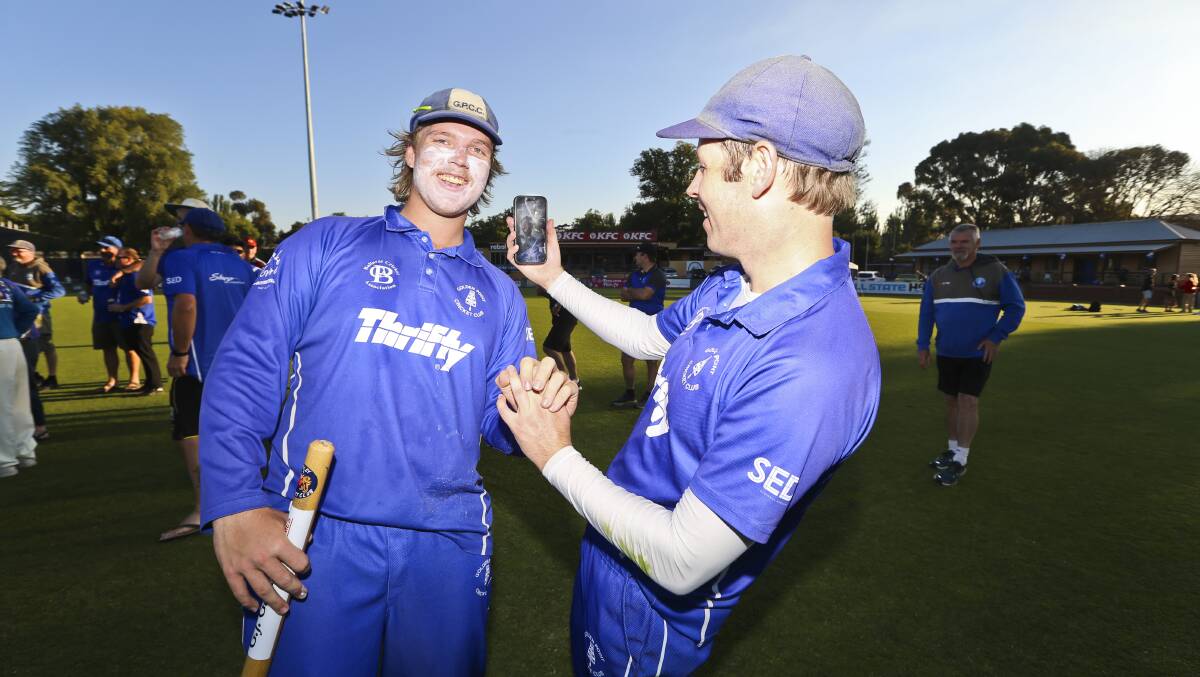Golden Point batters Josh Pegg and Josh White video call coach Daniel McDonald who was forced into isolation on the eve of the grand final. Picture: Luke Hemer