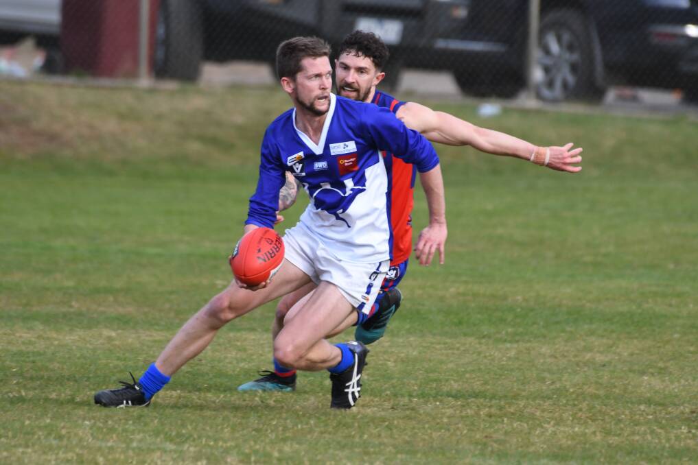 Waubra's Austin Murphy tries to evade his opponent. Picture: Kate Healy