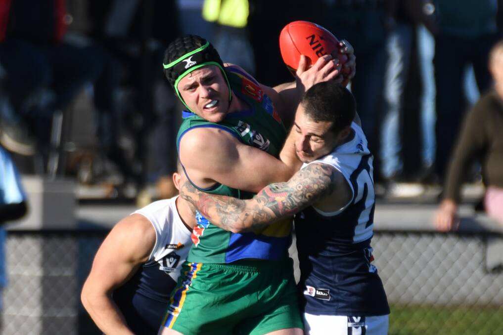 Ash Simpson tries to break out of a contest in his 100th senior game for Lake Wendouree. Picture: Kate Healy