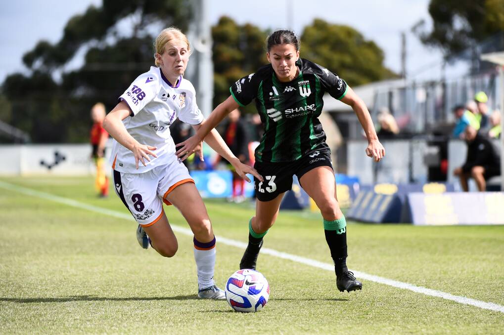 Perth Glory's Hana Lowry and Western United's Angela Beard compete for the ball at Morshead Park on Saturday afternoon. Picture by Adam Trafford.