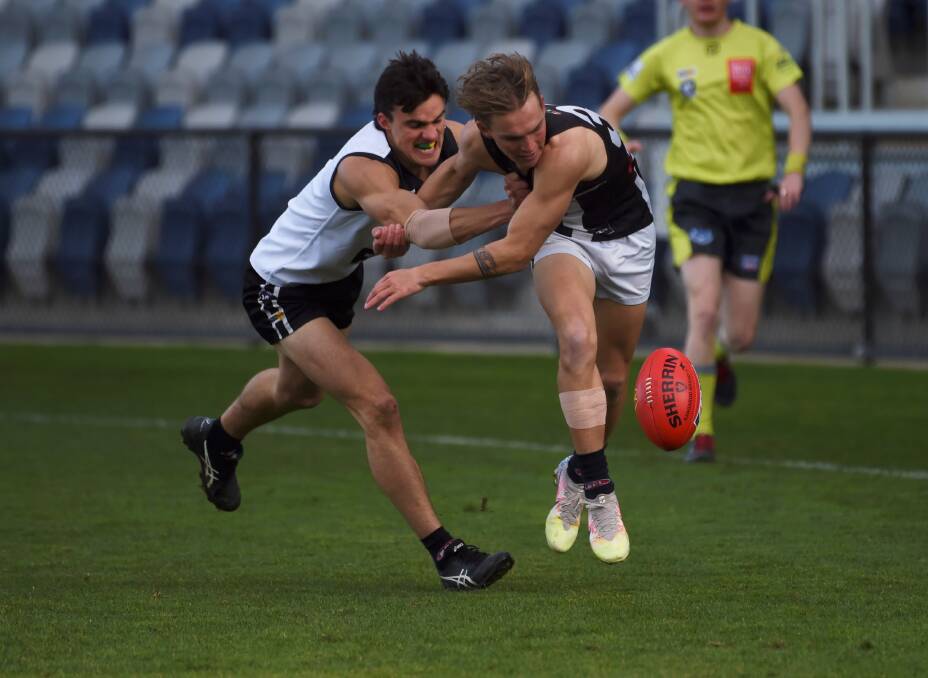 North Ballarat's Jamie Quick and Darley's Mitch Ward challenge for the loose ball. Picture: Lachlan Bence