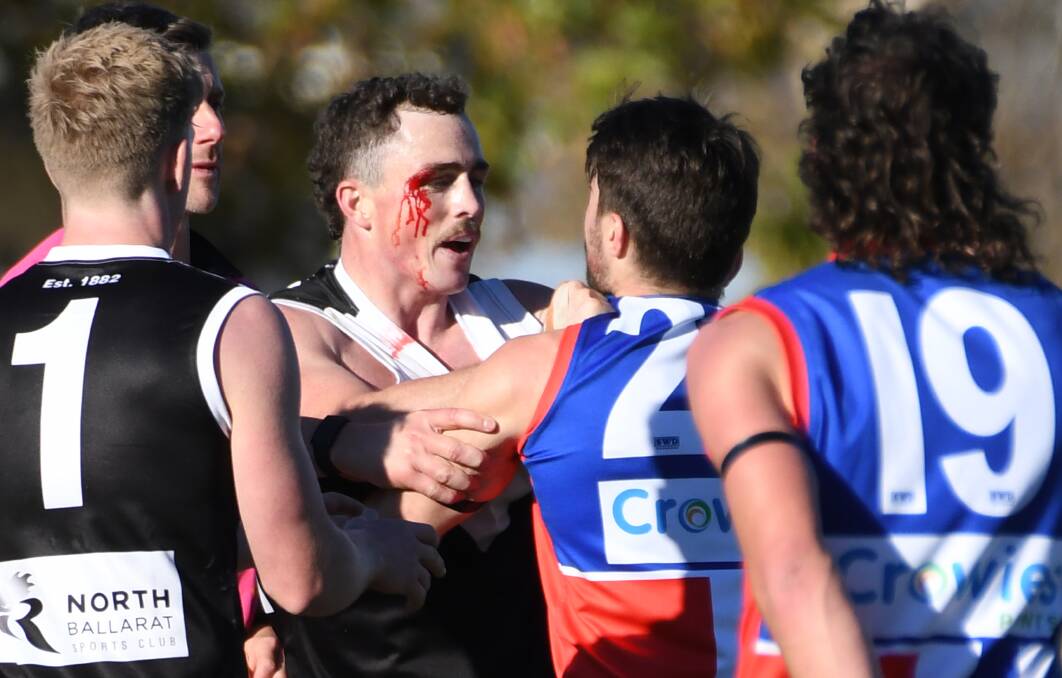 North Ballarat's Josephy Symons and East Point's Billy Jones get acquainted in round six. Picture: Kate Healy