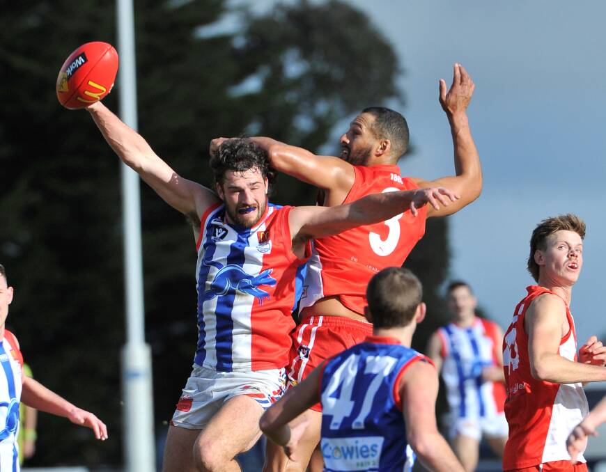 East Point's Jacob Brown and Ballarat's Josh Gibson fly in the reverse fixture last year. Picture: Lachlan Bence