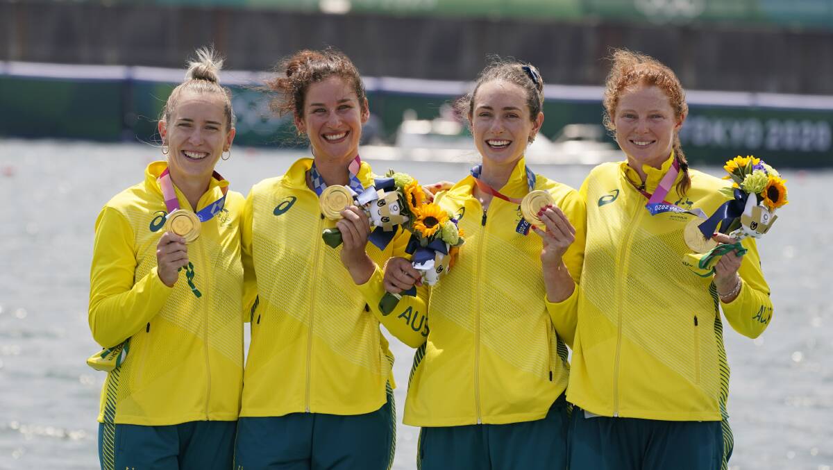 Lucy Stephan, left, on the podium with crewmates Rosemary Popa, Jessica Morrison and Annabelle McIntyre. Picture: Darron Cummings/AP