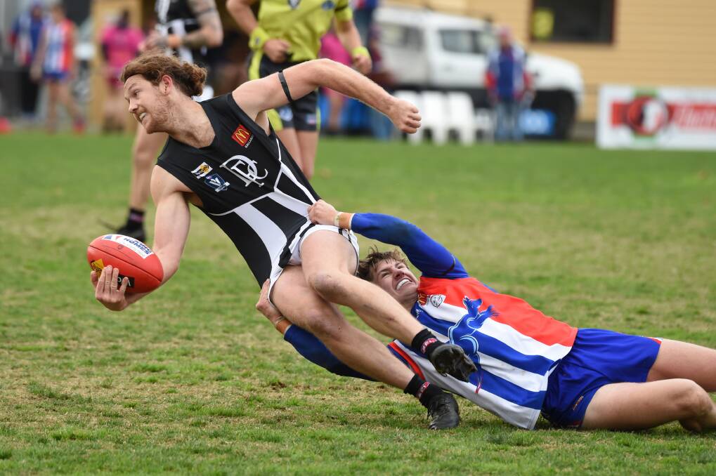 Matthew Brett is dragged to the ground. Picture: Kate Healy