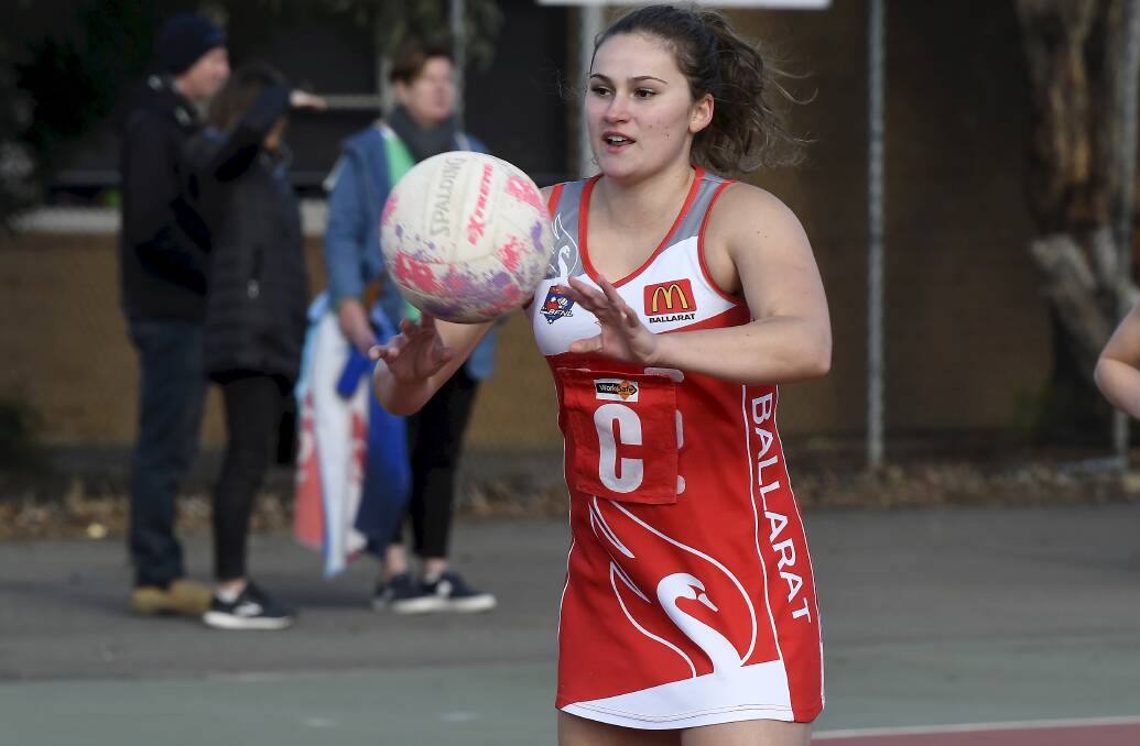 Amelia Cross moves the ball on. Picture: Lachlan Bence