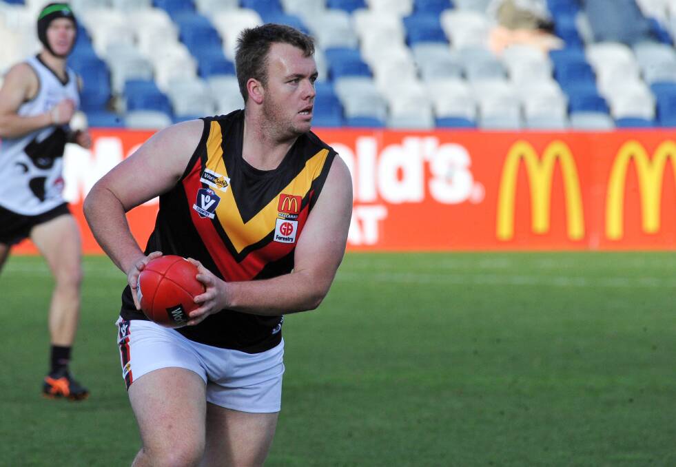 Thomas Wardell moves the ball from Bacchus Marsh's backline. Picture: Lachlan Bence