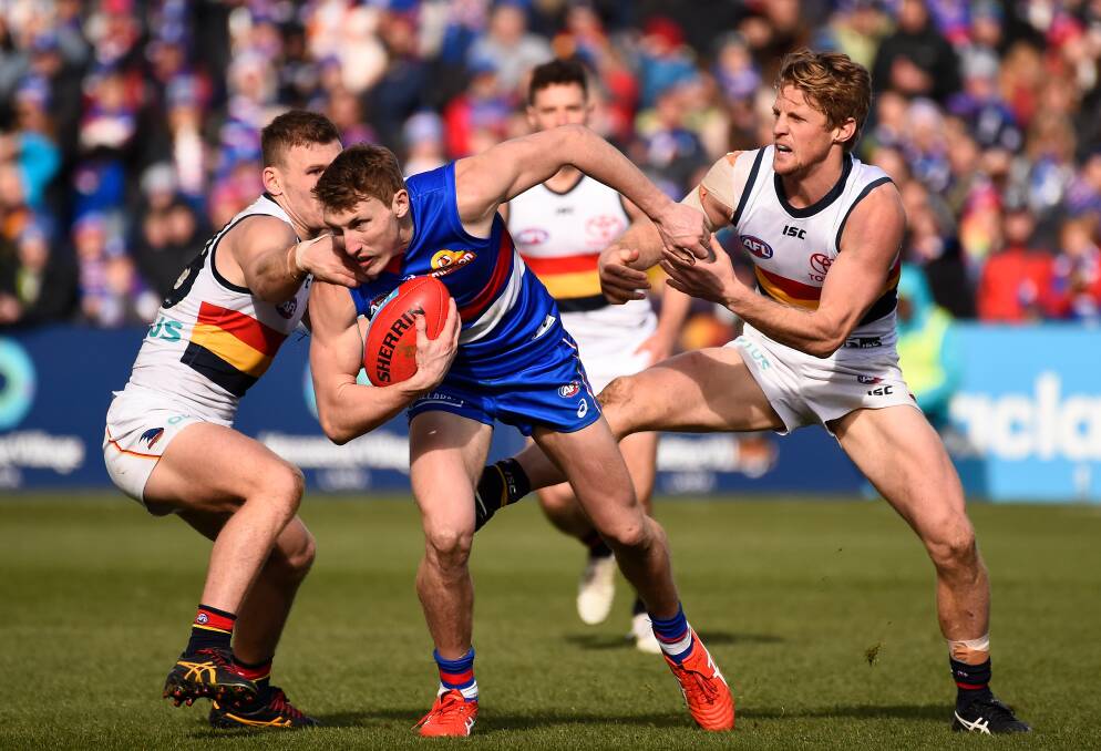 CONTEST: Western Bulldogs' Bailey Dale tries to evade Adelaide captain Rory Sloane in the Dogs' 2019 clash against the Crows at Ballarat. Picture: Adam Trafford