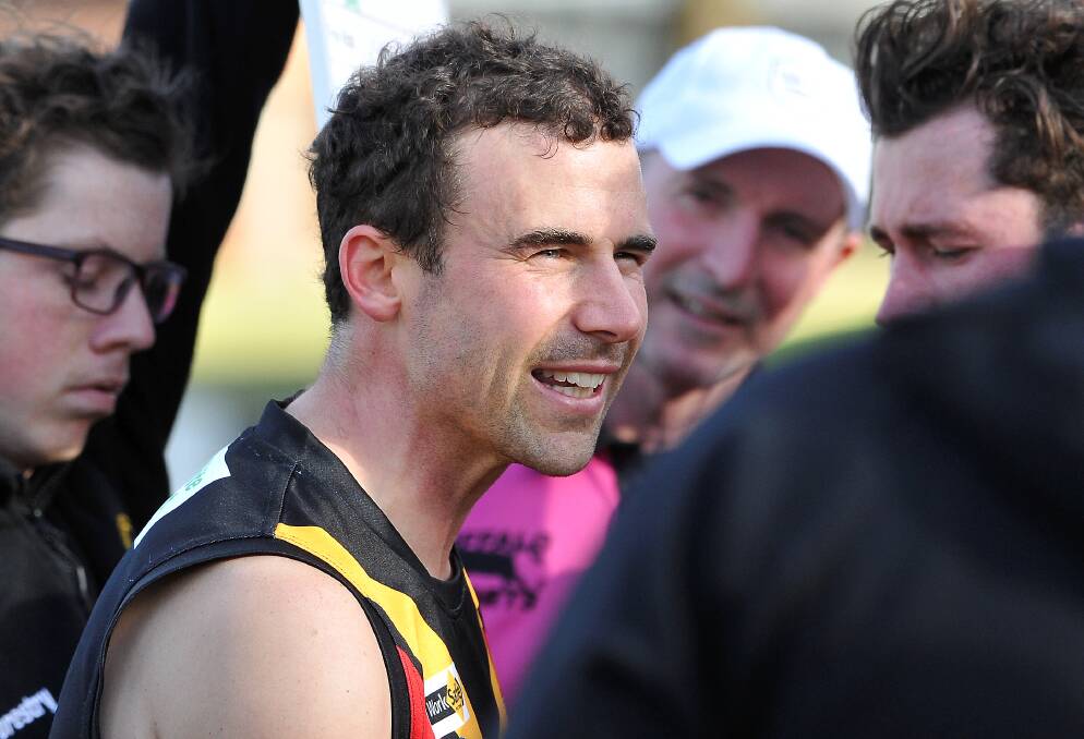 Bacchus Marsh coach Tom German addresses his charges. Picture: Lachlan Bence