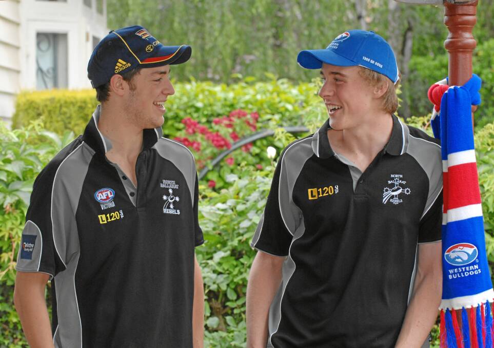 Jordan Roughead, right, after being drafted from the Rebels in 2008.