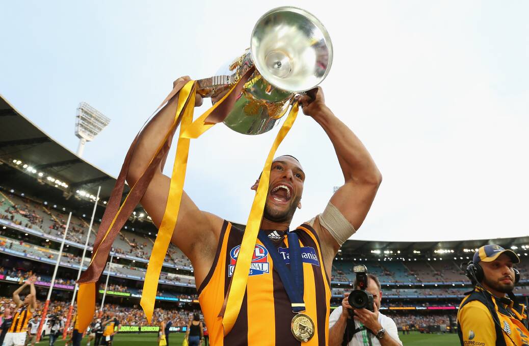 CHAMPION: Josh Gibson celebrates one of
his three AFL premierships with Hawthorn.
Picture: Getty Images