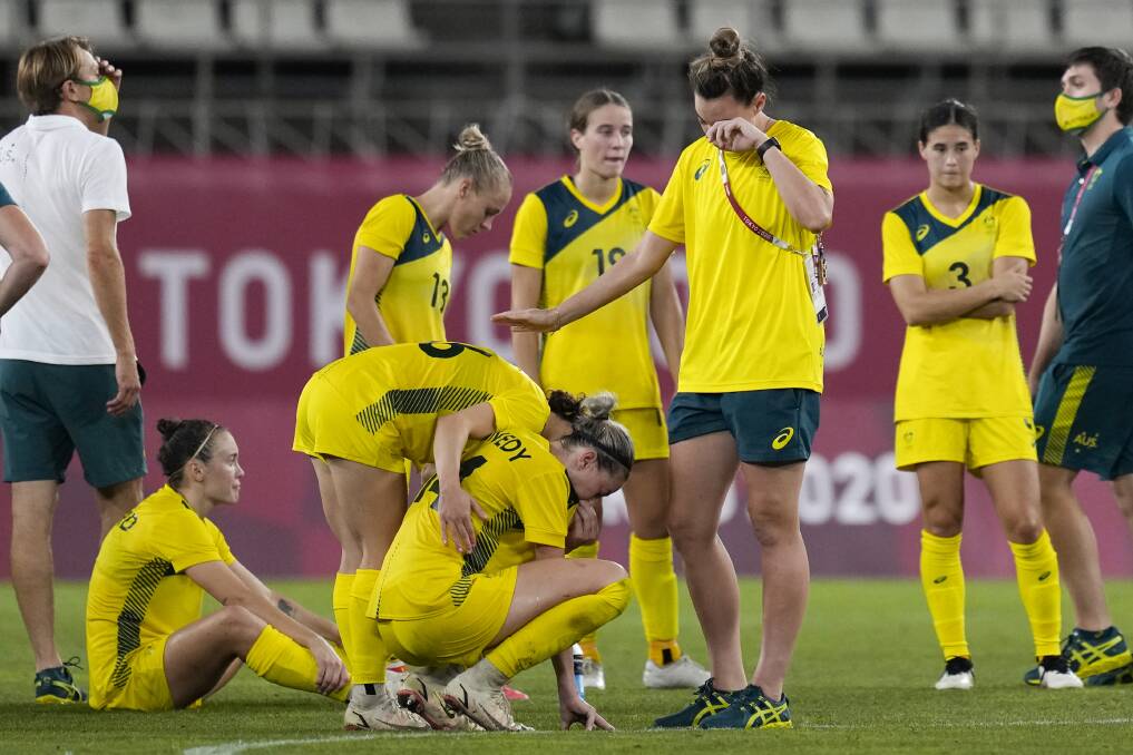 Kyra Cooney-Cross and the Matildas after losing the bronze medal match. Picture: AP/Andre Penner