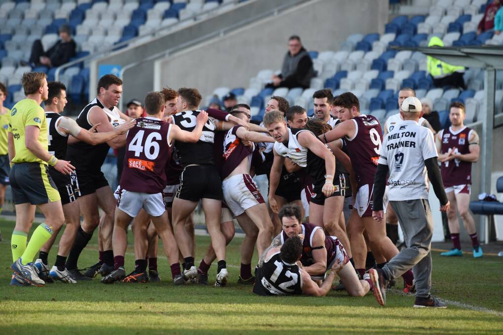 North Ballarat and Melton players in a melee following the incident. Picture: Kate Healy