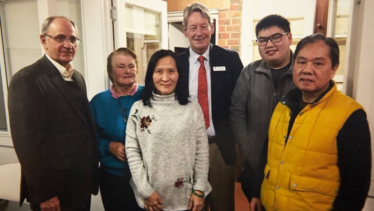 SMILING FACES: Shirley Doon, Peter Lo, Kim Mao and Billy Lo with Robert Tommasini and David Fisken of the Fiona Elsey Cancer Research Institute. 
