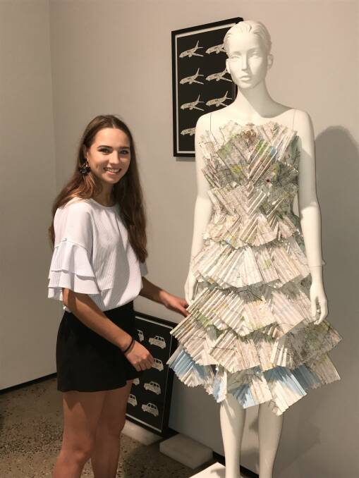 TRAVEL: Jasmine Fitzpatrick with her travel-inspired dress made of maps and her two etchings that are part of the Next Gen exhibition at the Art Gallery of Ballarat. Picture: Michelle Smith