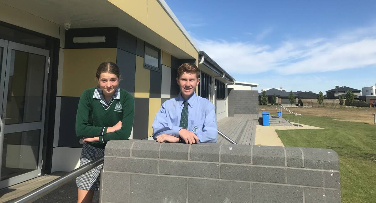 OWN IDENTITY: Molly and Adam outside the new year nine building at Ballarat High School. Picture: Michelle Smith