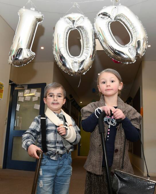 SMARTER: Alfredton Primary School pupils Ari and Natalya dress as centenarians to celebrate 100 days of prep and the first century of their school education. Picture: Lachlan Bence 