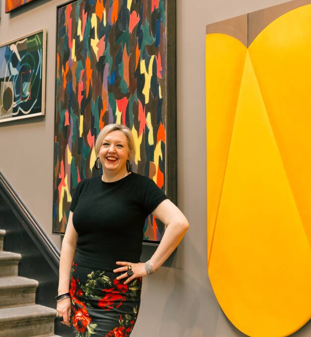 OPEN: Art Gallery of Ballarat director Louise Tegart in front of the newly painted main wall which has been rehung with works from the gallery collection. Picture: supplied