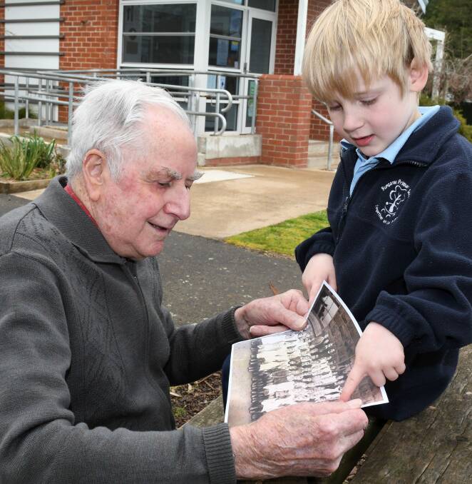FAMILY TIES: David Grigg, 90, shows Zac, 5, a picture of his mother Fanny Trigg in a Bungaree Primary School class photo from 1900. Picture: Lachlan Bence 