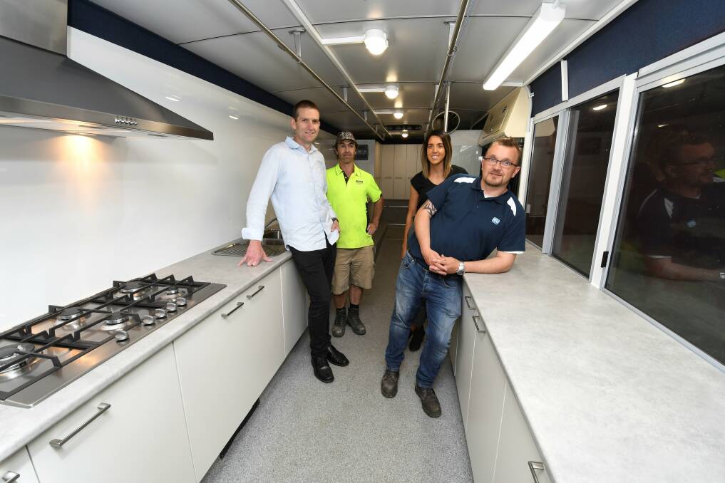INSIDE: OnTrack Foundation's second soup bus is ready to head out and serve more meals. Advanced Cabinetry staff Clint Smith, Terry Brogan, Monica Menz and Dave Barendsen inspect the final product. Picture: Lachlan Bence.