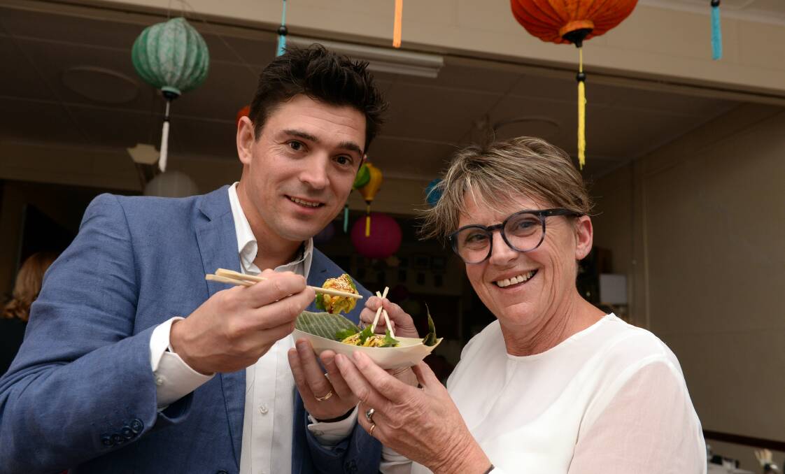 BANQUET: Ballarat Foundation chief executive Matt Jenkins and fundraising coordinator Margo Pettit tuck in to a serve of dumplings, the first course of the Asian-inspired Food for Thought rescued food feast, part of Plate Up Ballarat. Picture: Kate Healy