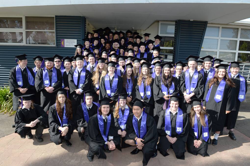COHORT: Phoenix P-12 College's class of 2018 strike a formal pose outside the school on their last day. Picture: Kate Healy