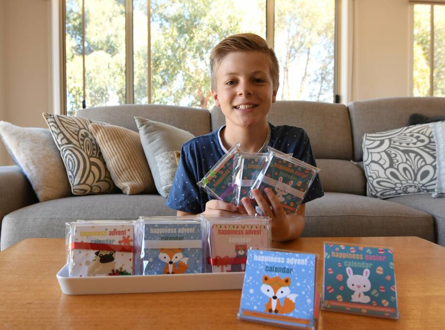 BIG-HEARTED: Jake Sbardella, 12, with the Easter advent calendars he is selling to raise money to buy backpack beds for the homeless. His goal is to reach $10,000 raised and donated to local agencies. Picture: Lachlan Bence