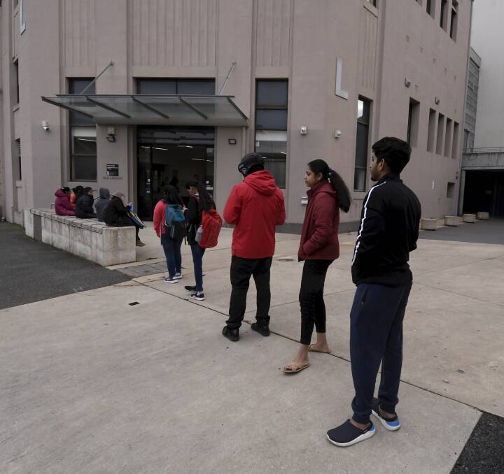 WAITING: Students wait to go in to the community pantry at Federation University's Camp Street campus to pick up food and other essentials. Picture: Lachlan Bence