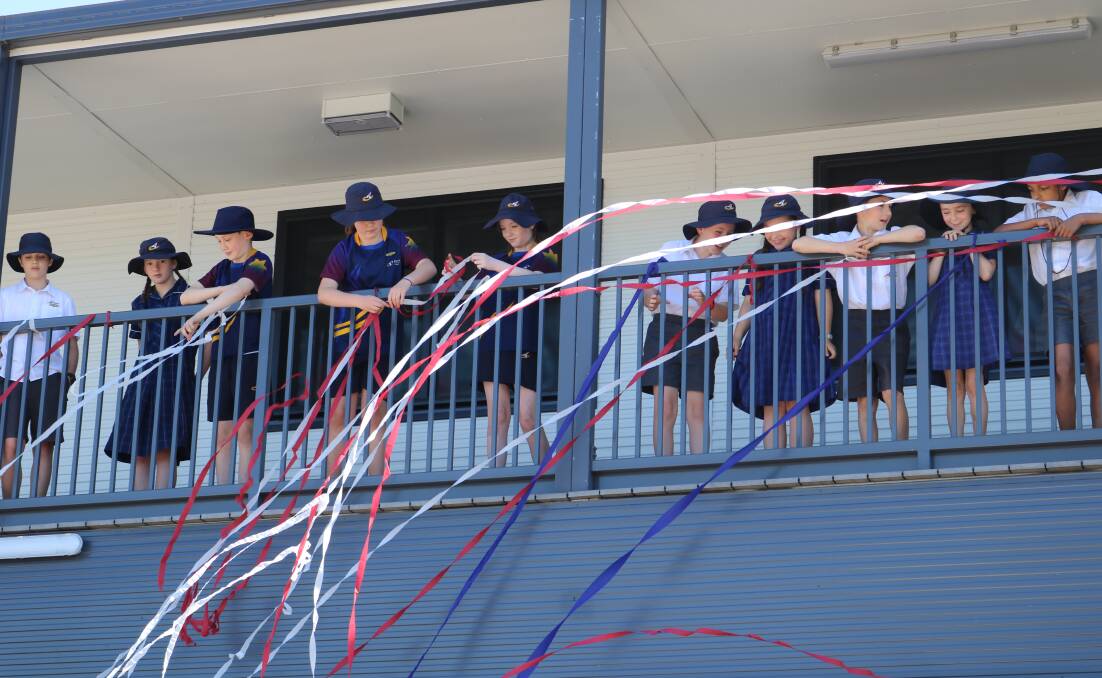 OPEN: Ballarat Christian College primary pupils throw streamers to celebrate the opening of the school's new primary wing. 