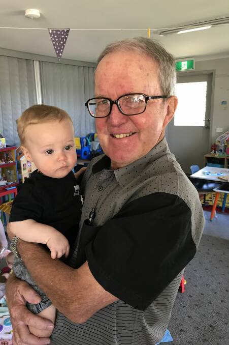 CUDDLES: Peter Innes cradles Kaiden, 10 months, in the playroom at the Young Parent Program's Delacombe home. Picture: Michelle Smith