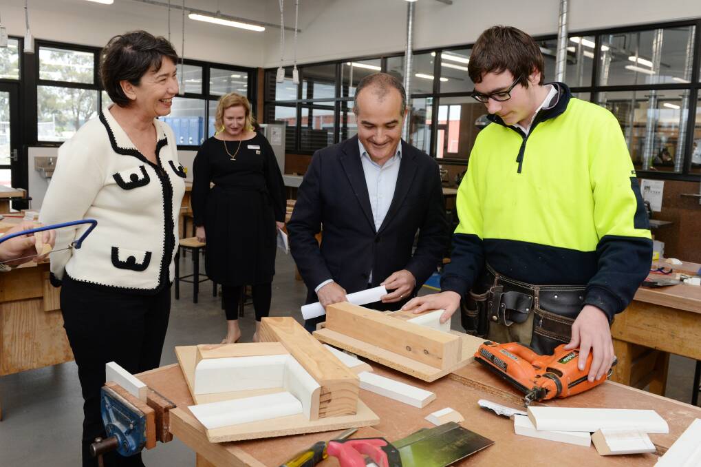WOODWORK: Buninyong's Labor candidate Michaela Settle, Phoenix College principal Karen Snibson, education minister James Merlino and Ross Hocking, year 11, in the school's new materials technology wing. Picture: Kate Healy