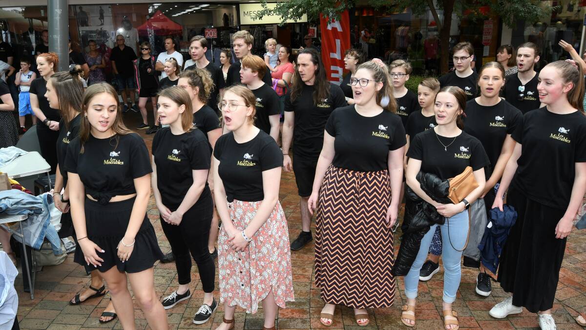 The flash mob in full song. Picture: Lachlan Bence