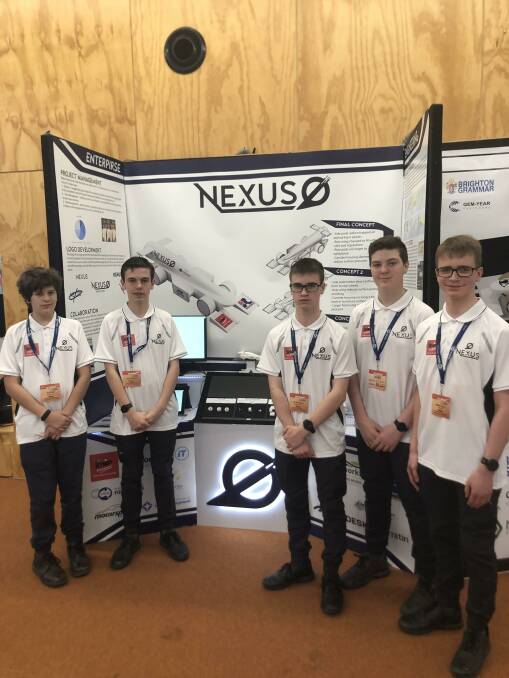 The Phoenix Nexus team in front of their pit display at the state titles. Picture supplied