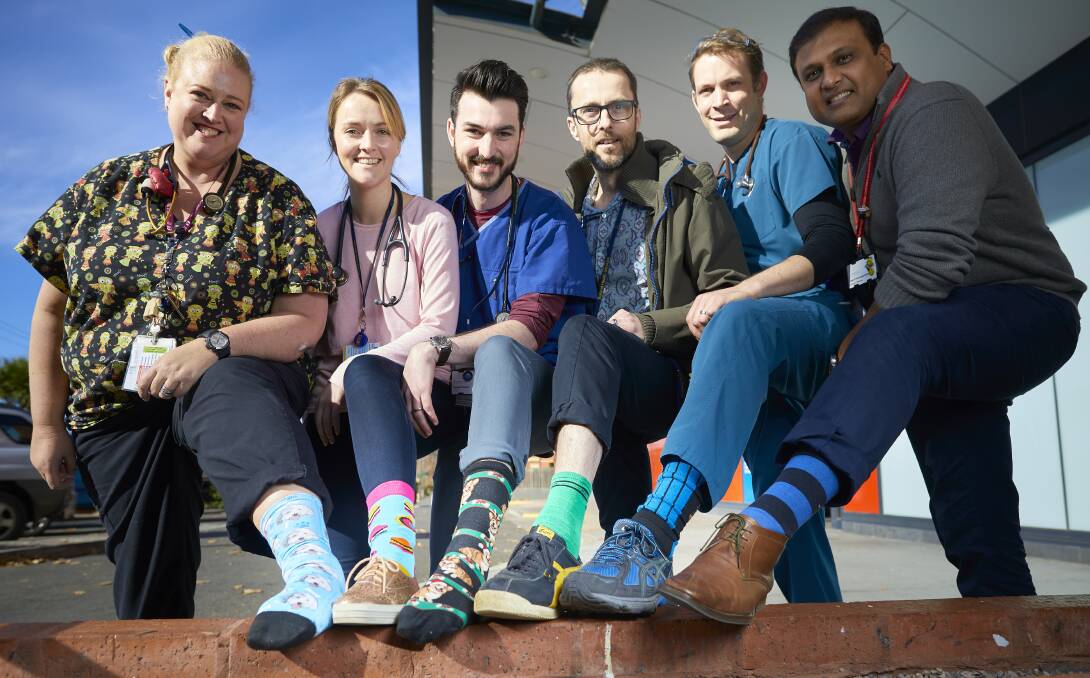 SOCKS: Ballarat emergency doctors Pauline Chapman, Megan Hardy, Russell Pearce, Mark Hartnell, Ben Jacka and Rajesh Sannappareddy show their colours and support for Crazy Socks 4 Docs Day. Picture: Luka Kauzlaric