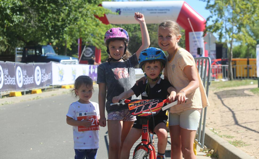 Ria, Mila, Oscar and Madeline cheer on the finishers after completing the 6km Lake Ride. Pictures by Michelle Smith 