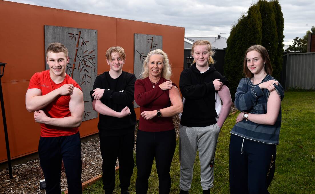 READY: Elisa Zentveld (centre) is ensuring her whole family are protected with all four of her teenage children James, 18, Jonathan, 15, Sebastian, 15, and Chantelle, 16, getting their Pfizer jab this week. Picture: Adam Trafford