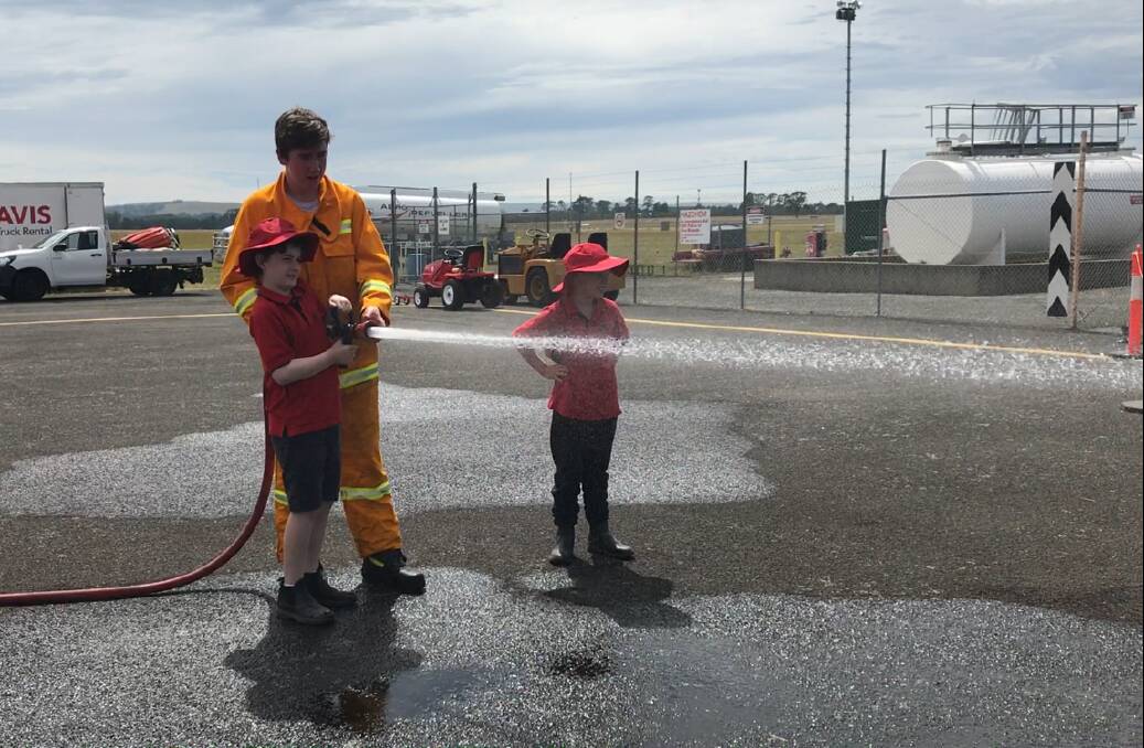 WATER FIGHT: Scotsburn students also got the chance to try out the fire hoses on the Buninyong CFA fire truck.

