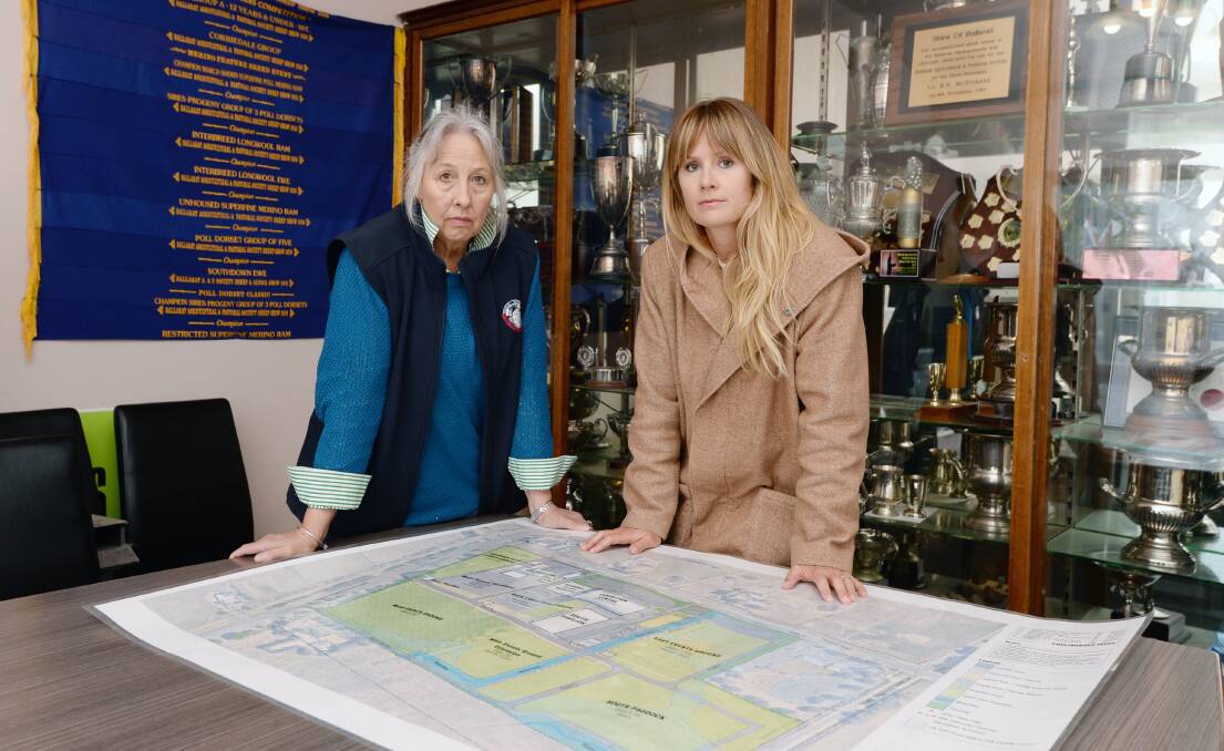 Ballarat Agricultural and Pastoral Society administration officer Georgina Walton and event coordinator Jackie Kalogerakis with plans for the new Mount Rowan showgrounds which will not be ready to host the show until 2025. Picture by Kate Healy