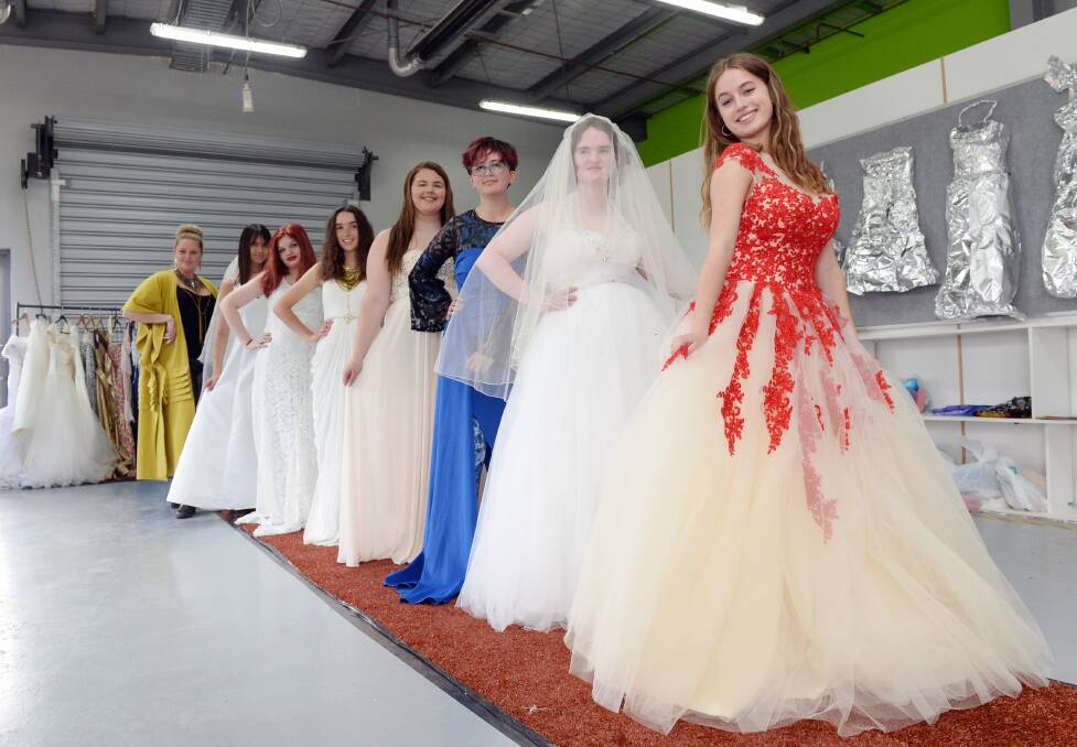 VET Applied Fashion Design and Technology trainer Jo Hall and students Tatum Millsom, Cindesty Lucas, Freya Manton, Isabella Munro, Adaleeta Watson, Bella Smith and Siena Grant. Picture by Kate Healy